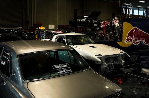 a garage filled with lots of old cars