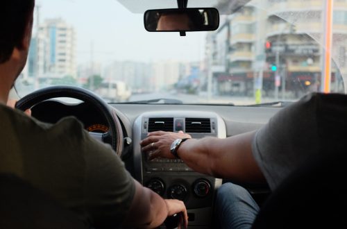 two person riding vehicle during daytime